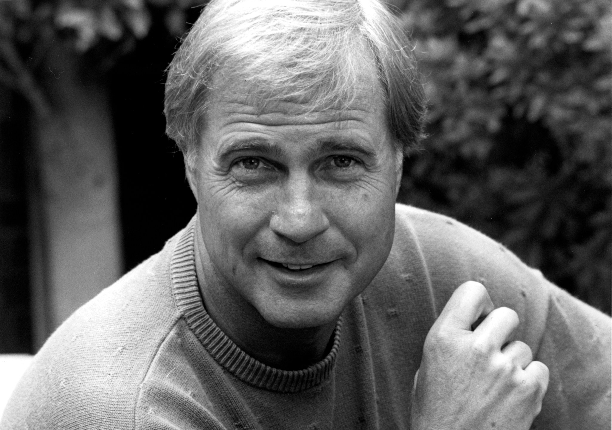 FILE - Actor Gil Gerard poses in Los Angeles, Ca. on July 16, 1990. (AP Photo/Reed Saxon, File)