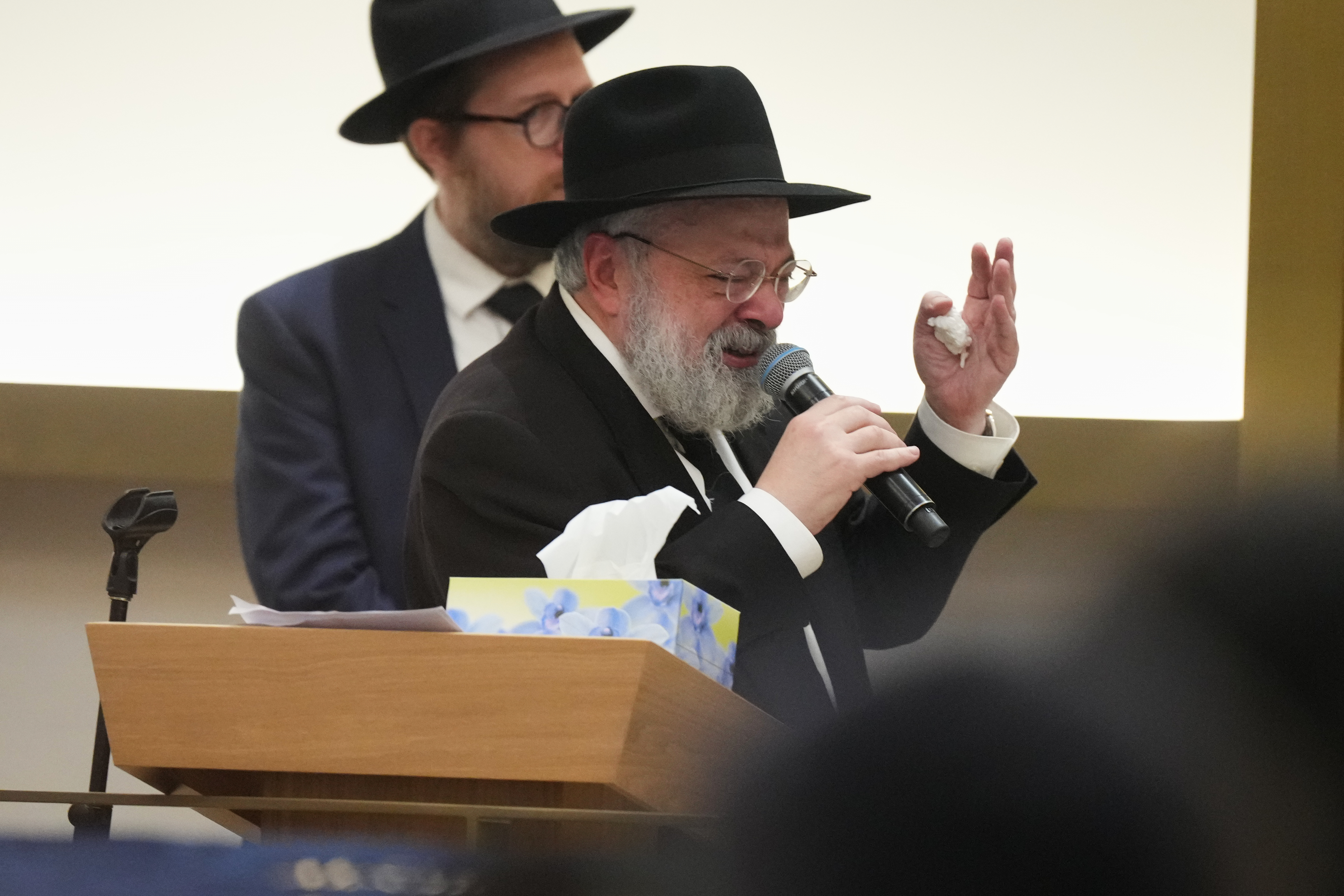 Rabbi Yehoram Ulman, father-in-law of Rabbi Eli Schlanger, a victim in the Bondi Beach mass shooting, speaks at his funeral at a synagogue in Bondi on Wednesday, Dec. 17, 2025, in Sydney, Australia. (AP Photo/Mark Baker, Pool)