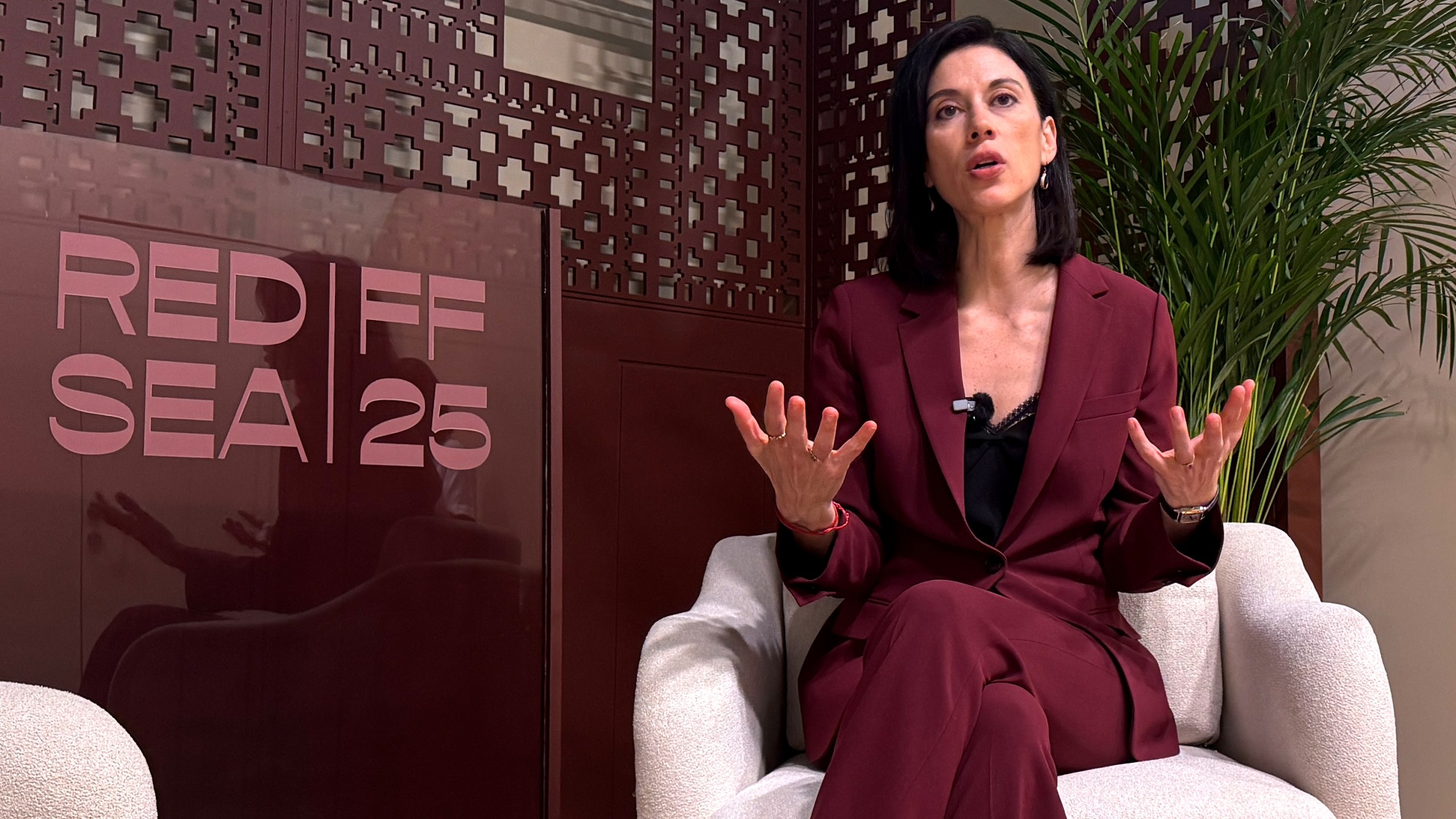 Filmmaker Cherien Dabis speaks during an interview with The Associated Press about her early career in cinema at the Red Sea International Film Festival in Jeddah, Saudi Arabia, Monday, Dec. 8, 2025. (AP Photo/Baraa Anwer)