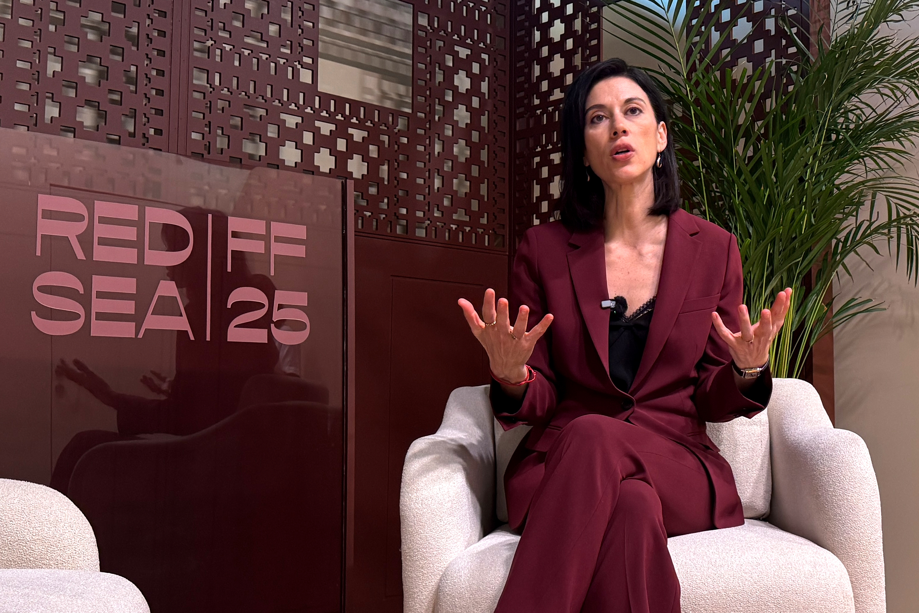 Filmmaker Cherien Dabis speaks during an interview with The Associated Press about her early career in cinema at the Red Sea International Film Festival in Jeddah, Saudi Arabia, Monday, Dec. 8, 2025. (AP Photo/Baraa Anwer)