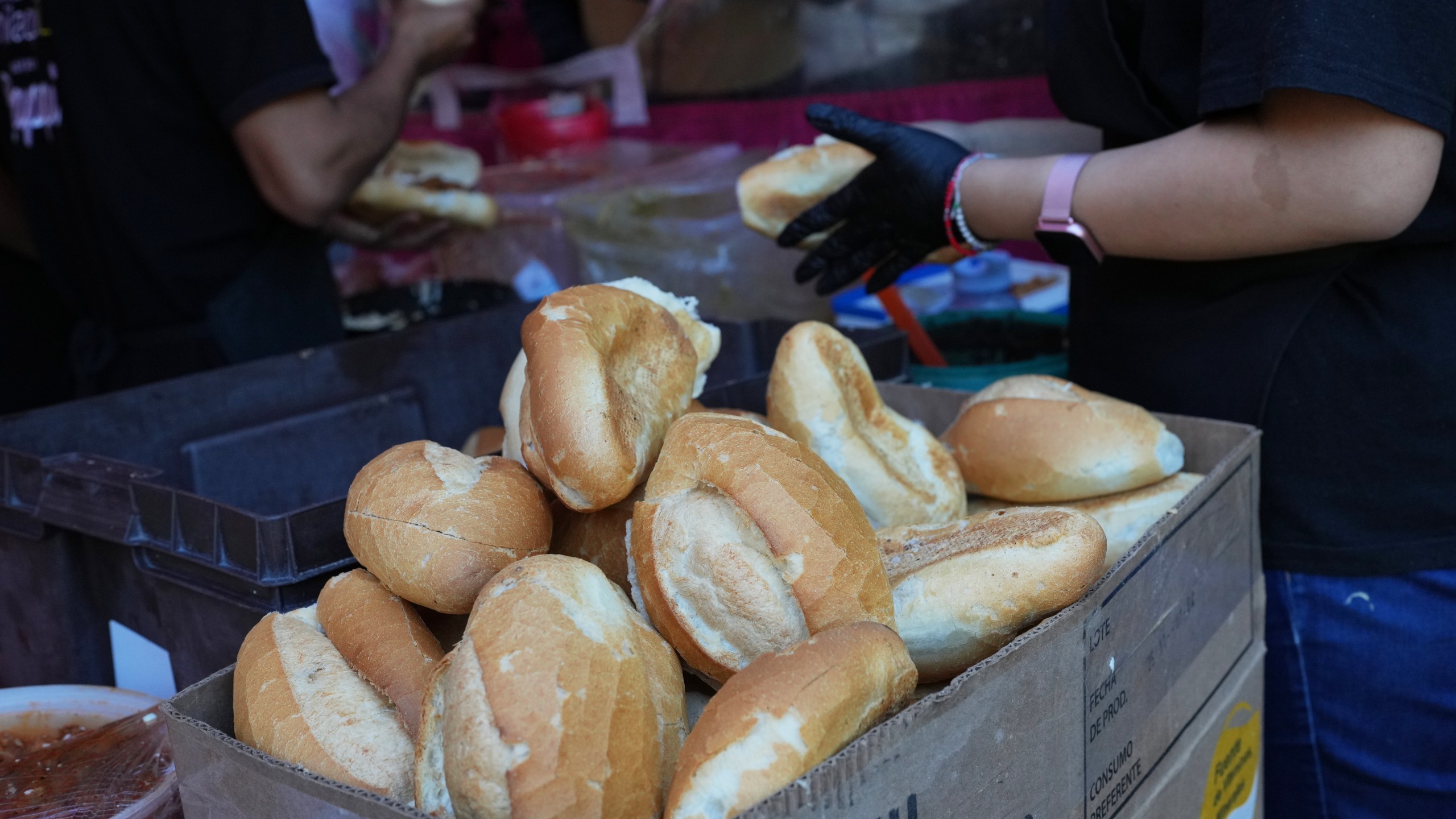 Bolillos, a traditional Mexican bread, sit for sale at a street stand in Mexico City, Thursday, Dec. 18, 2025. (AP Photo/Marco Ugarte)