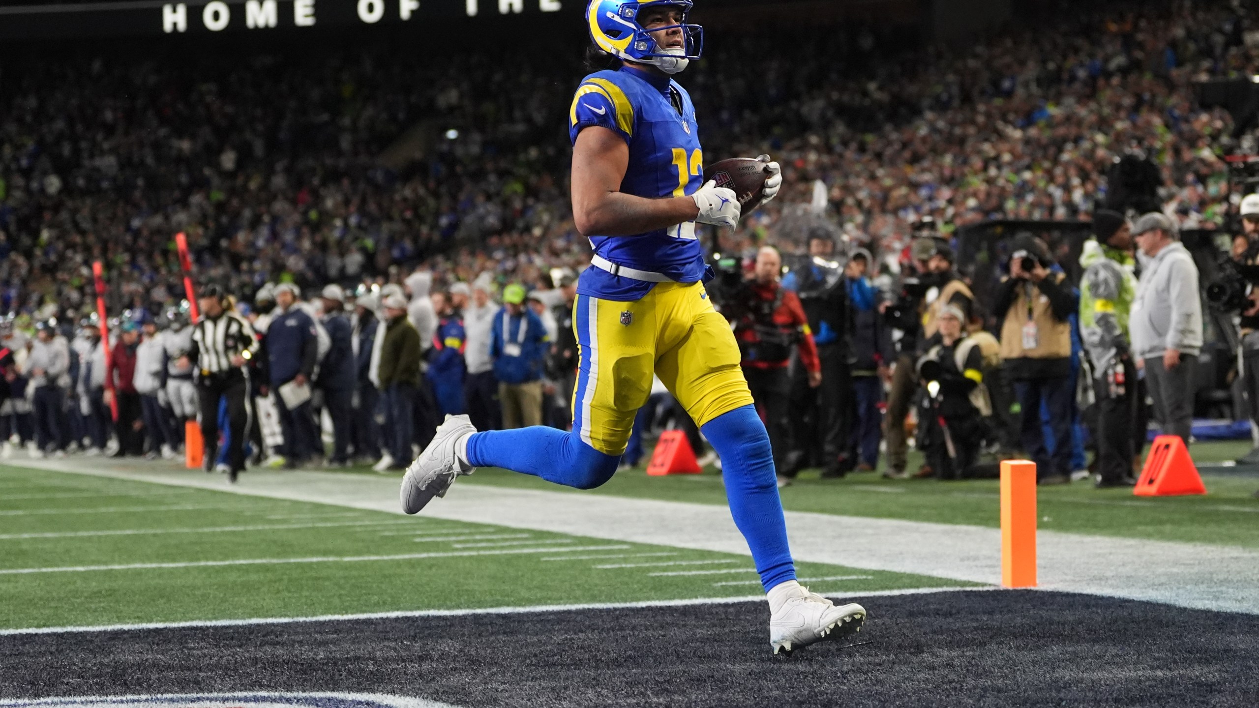 Los Angeles Rams wide receiver Puka Nacua scores a touchdown during overtime in an NFL football game against the Seattle Seahawks, Thursday, Dec. 18, 2025, in Seattle. (AP Photo/Lindsey Wasson)