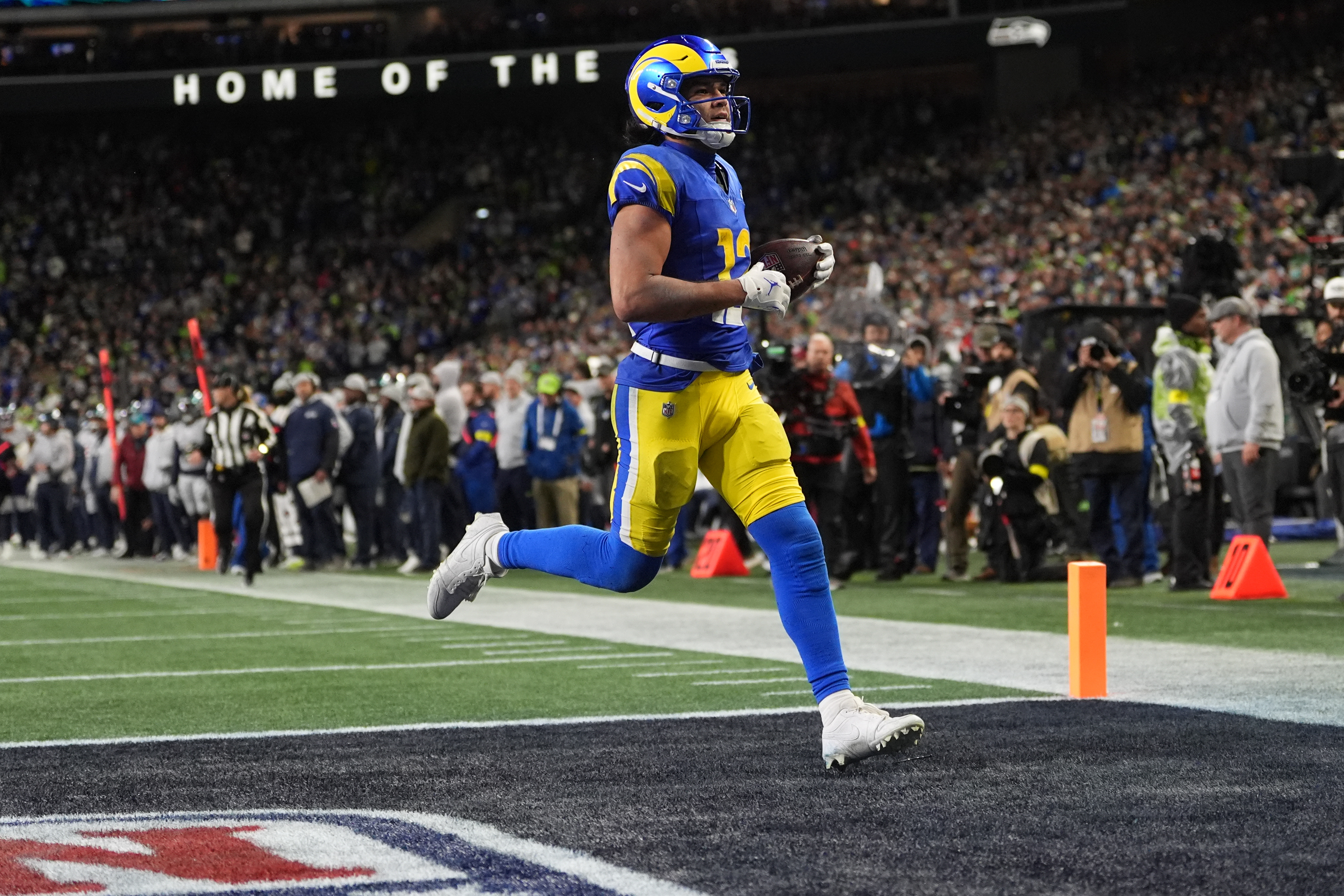 Los Angeles Rams wide receiver Puka Nacua scores a touchdown during overtime in an NFL football game against the Seattle Seahawks, Thursday, Dec. 18, 2025, in Seattle. (AP Photo/Lindsey Wasson)