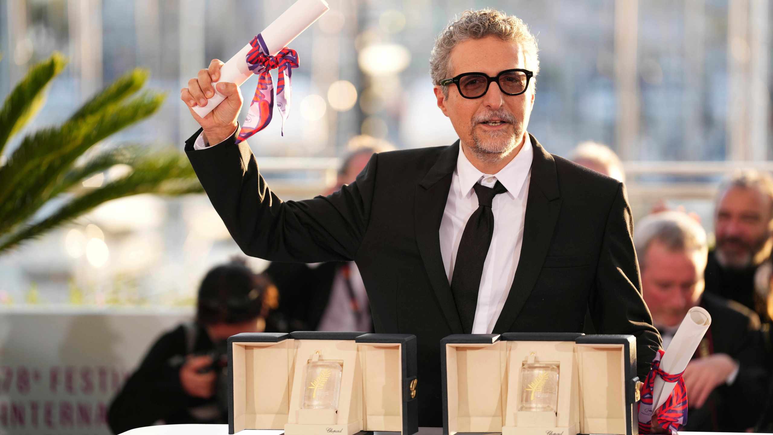 FILE - Director Kleber Mendonca Filho poses with his award for best director for the film "The Secret Agent" as well as the best actor award received on behalf of Wagner Moura at the awards ceremony photo call at the 78th international film festival, Cannes, France, May 24, 2025. (Photo by Scott A Garfitt/Invision/AP, File)