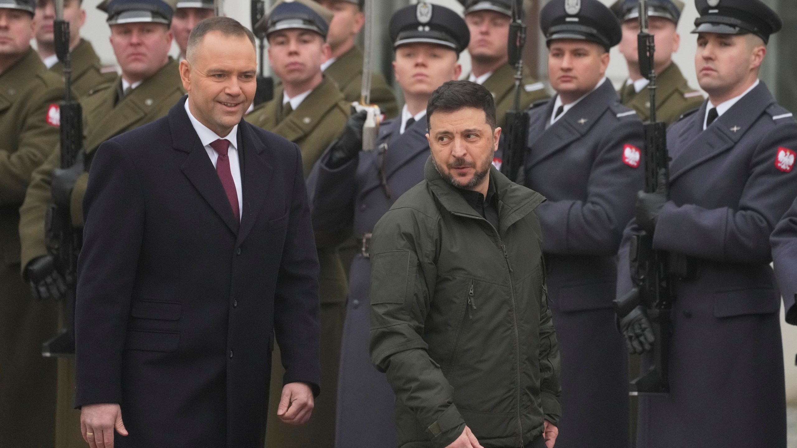 Polish President Karol Nawrocki, left, and Ukrainian President Volodymyr Zelenskyy attend an official welcome ceremony before their meeting at the Presidential Palace in Warsaw, Poland, Friday, Dec. 19, 2025. (AP Photo/Czarek Sokolowski)