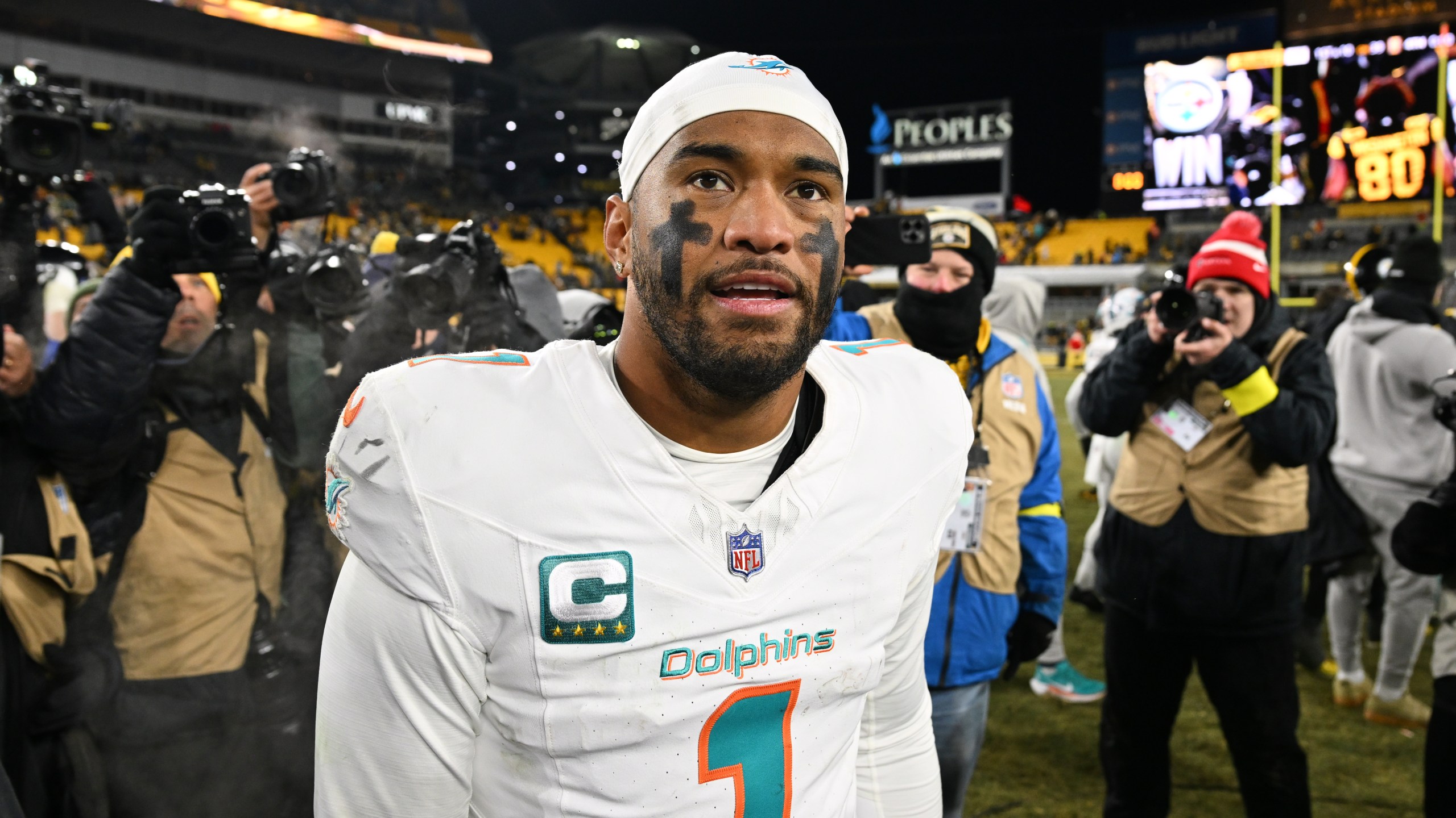 Miami Dolphins quarterback Tua Tagovailoa (1) walks off the field after an NFL football game against the Pittsburgh Steelers in Pittsburgh, Monday, Dec. 15, 2025. (AP Photo/Justin Berl)