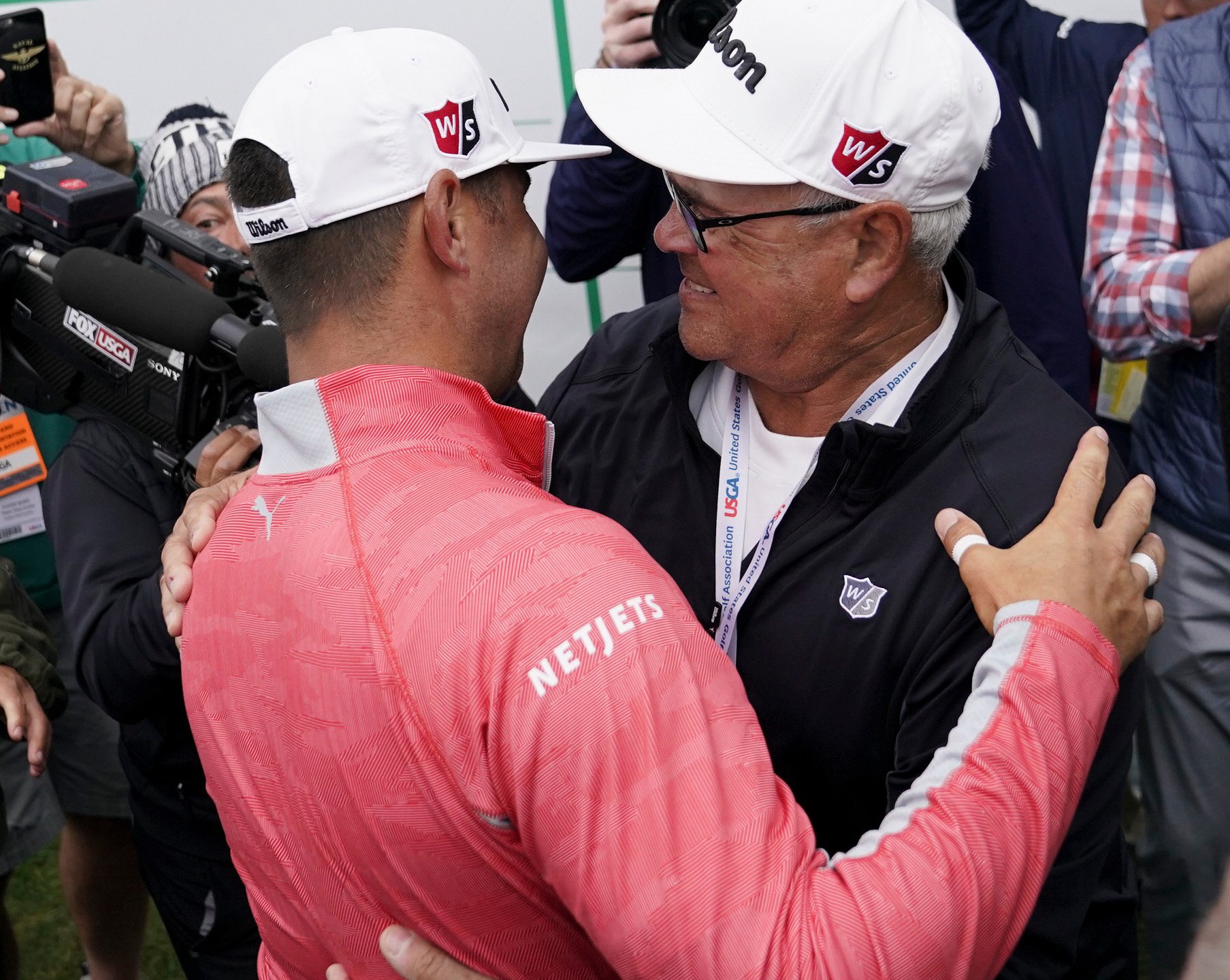 FILE - Gary Woodland celebrates after winning the U.S. Open Championship golf tournament with his father Dan, June 16, 2019, in Pebble Beach, Calif. (AP Photo/Carolyn Kaster, File)