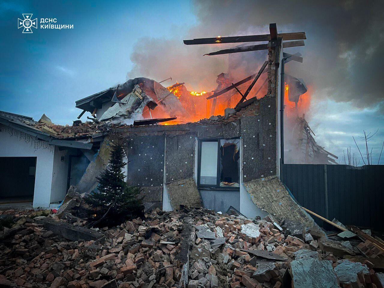 In this photo provided by the Ukrainian Emergency Service on Tuesday, Dec. 23, 2025, a residential house burns after a Russian strike in Kyiv region, Ukraine. (Ukrainian Emergency Service via AP)