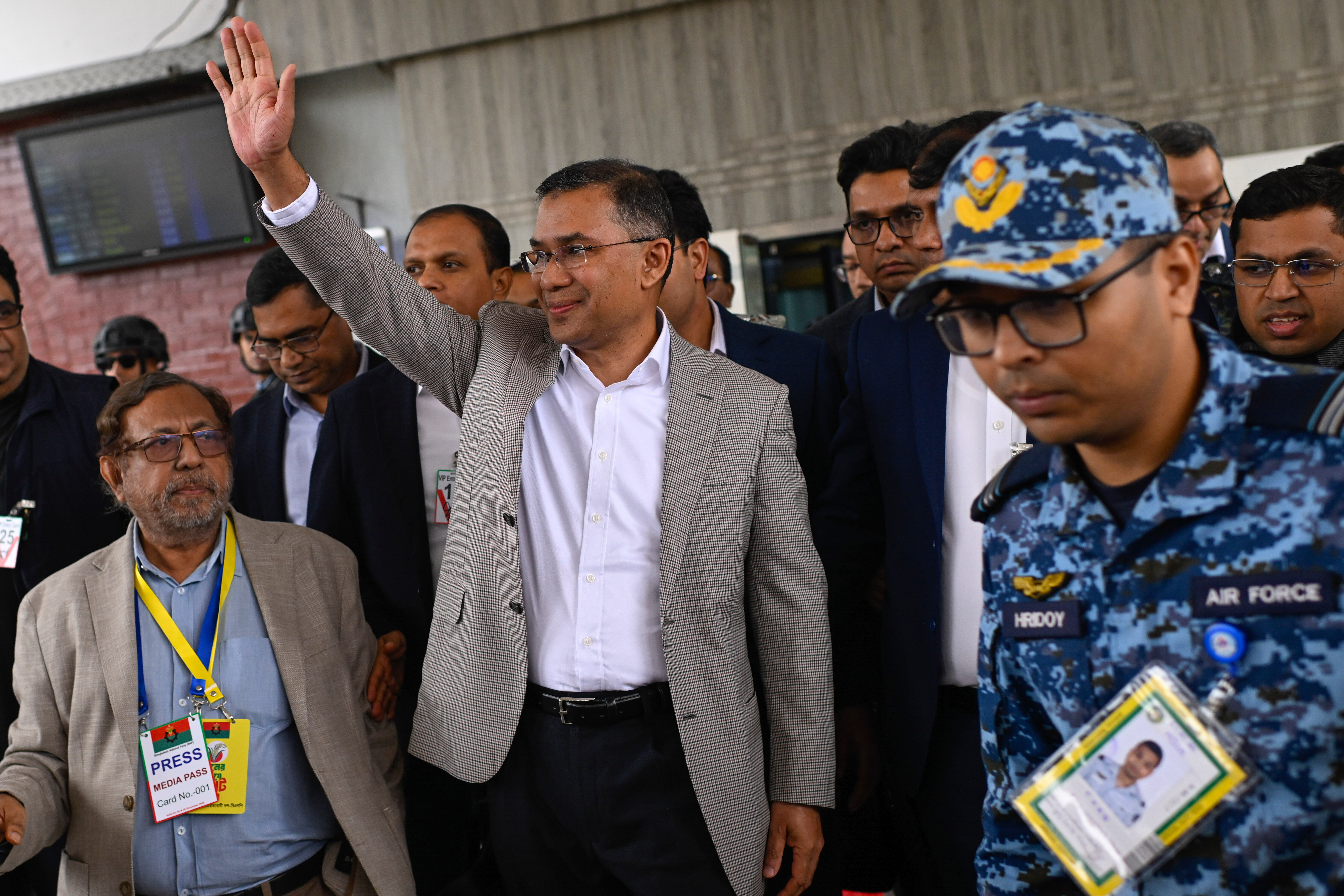 Bangladesh Nationalist Party (BNP) Acting Chairman, Tarique Rahman, waves to supporters at Hazrat Shahjalal International Airport in Dhaka after returning from London, ending more than 17 years of self-imposed exile, Thursday, Dec. 25, 2025. (AP Photo/Mahmud Hossain Opu)
