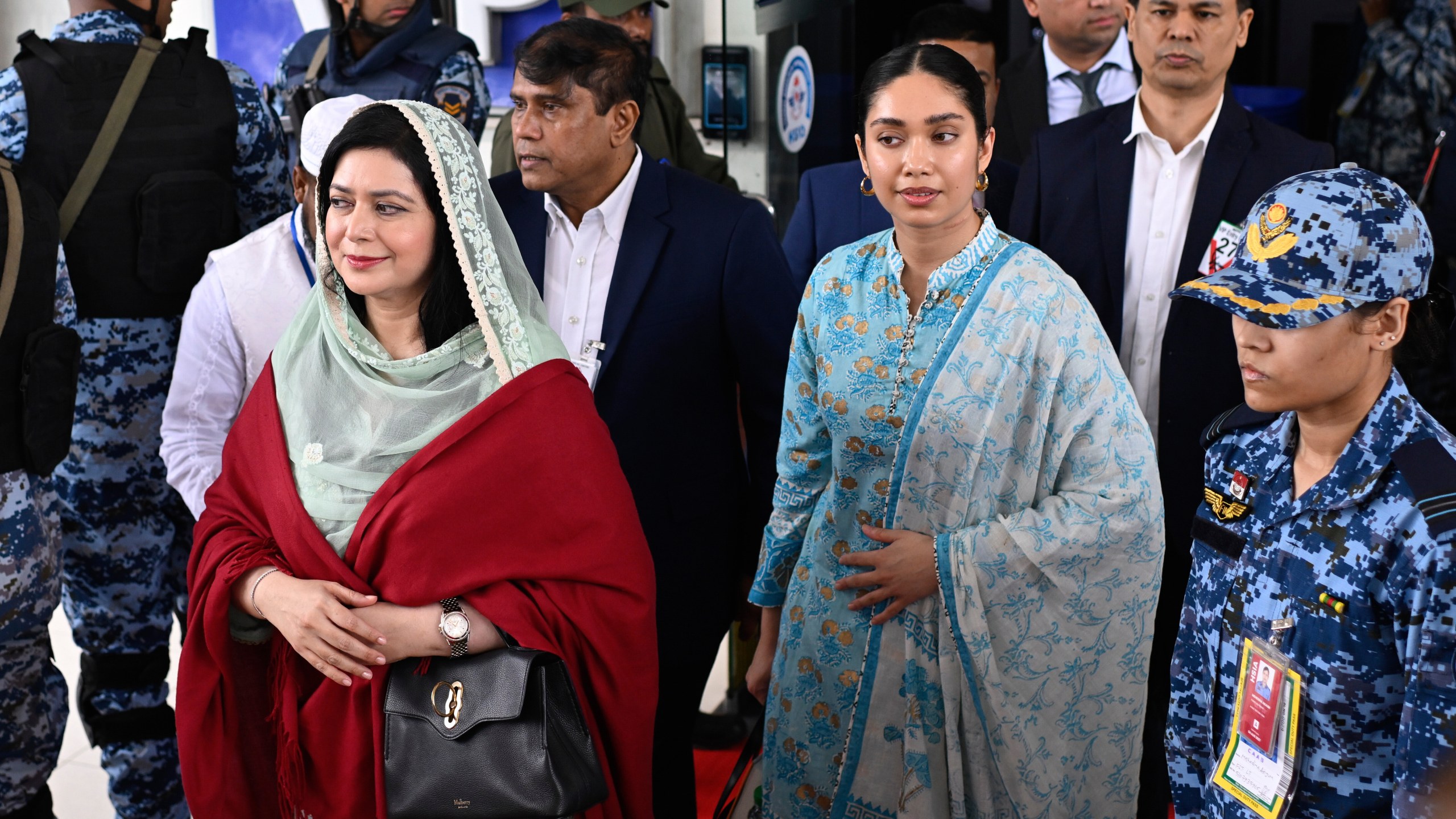 Bangladesh Nationalist Party (BNP) Acting Chairman Tarique Rahman's wife, Zubaida Rahman, left, arrives with her daughter Zaima Rahman at Hazrat Shahjalal International Airport in Dhaka, Bangladesh, as they return to the country, Thursday, Dec. 25, 2025. (AP Photo/Mahmud Hossain Opu)