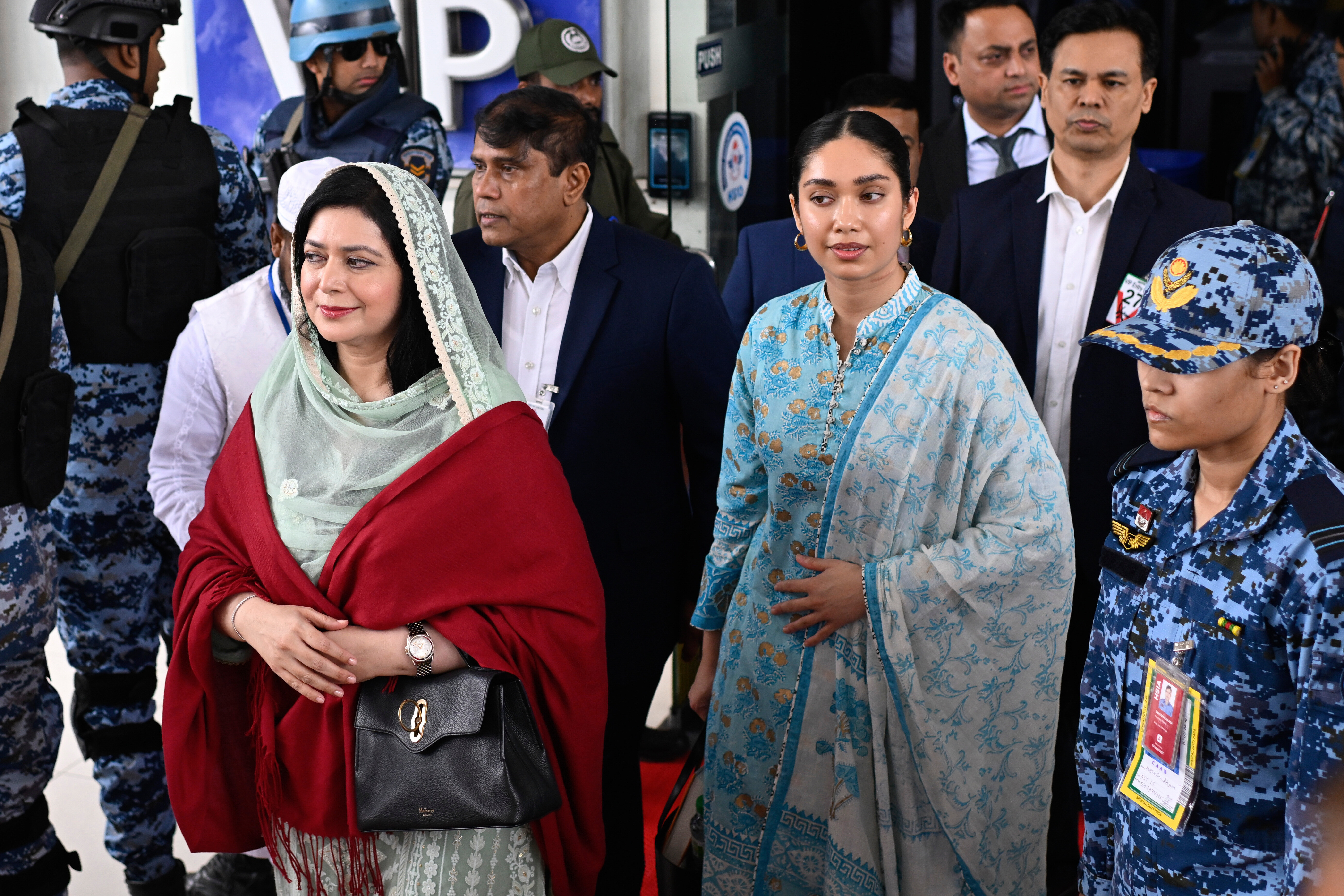 Bangladesh Nationalist Party (BNP) Acting Chairman Tarique Rahman's wife, Zubaida Rahman, left, arrives with her daughter Zaima Rahman at Hazrat Shahjalal International Airport in Dhaka, Bangladesh, as they return to the country, Thursday, Dec. 25, 2025. (AP Photo/Mahmud Hossain Opu)
