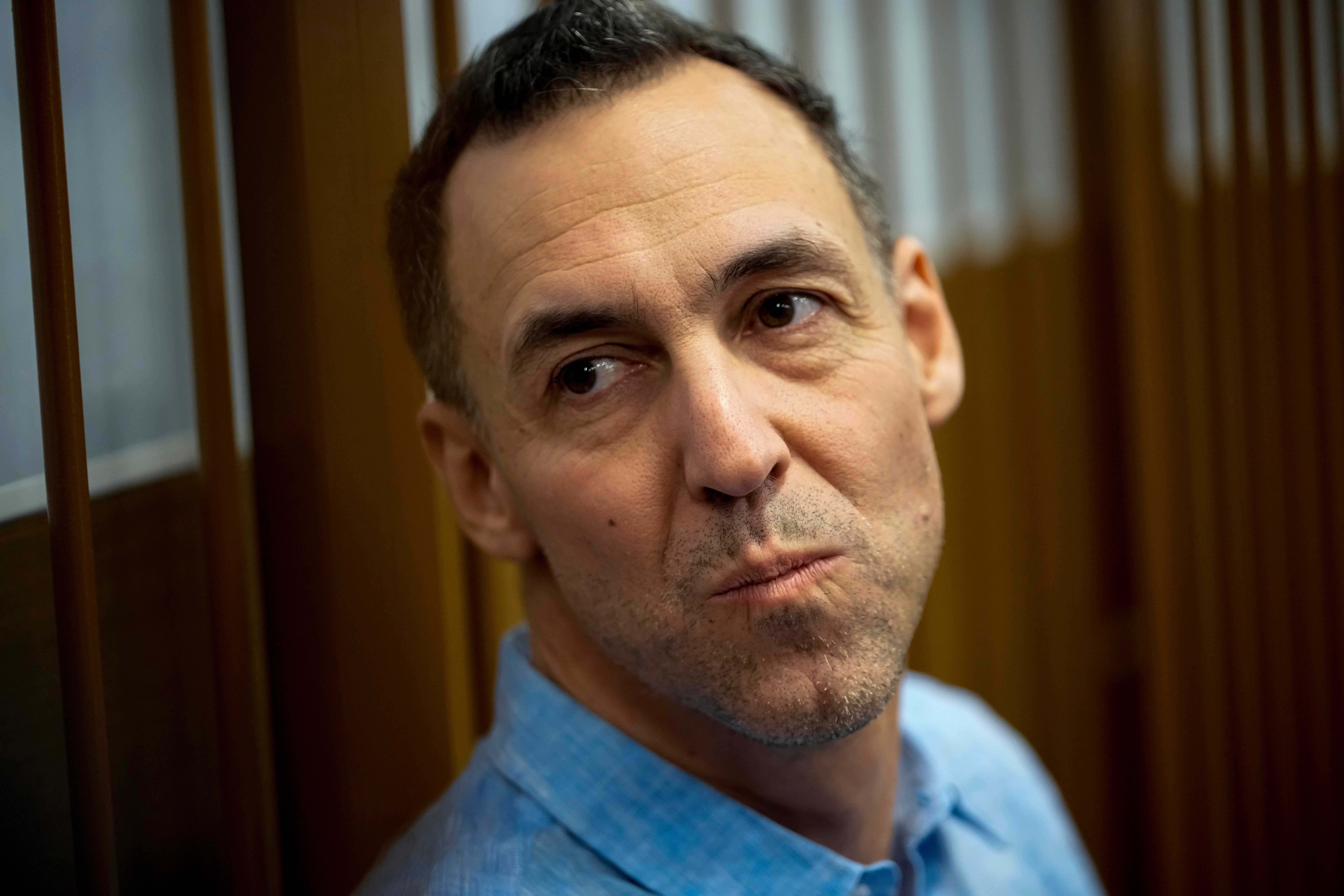FILE - French citizen Laurent Vinatier sits in a cage prior to a court session at the Zamoskvoretsky District Court in Moscow, Russia, on Monday, Oct. 14, 2024. (AP Photo/Pavel Bednyakov, File)